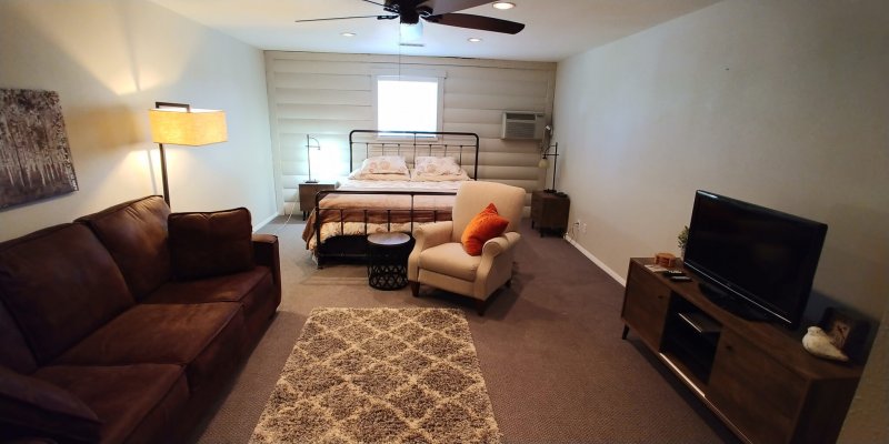 Bed and living area -- Find studio apartments in Boulder CO.