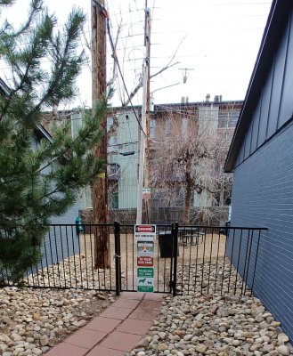 Entrance gate to the dog walk area at our dog friendly Boulder apartments.