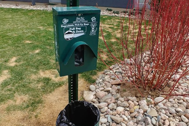 Pet waste station with bags and trash can